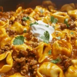 Cheesy Beef Enchilada Tortellini is a delightful fusion dish that brings together the best of Italian and Mexican cuisines. Imagine the al dente texture of tortellini enveloped in a rich, spicy beef filling, smothered in a creamy, cheesy sauce that sings with the vibrant flavors of enchilada seasoning. This recipe is not only a culinary adventure but also a practical solution for busy weeknight dinners, making it an ideal choice for families and food enthusiasts alike.