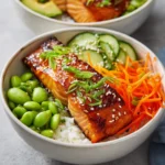 Discover the delightful world of the Miso Magic Salmon Bowl, a nutritious and vibrant dish that perfectly balances flavors and textures. It combines tender, marinated salmon with creamy avocado and a colorful medley of fresh vegetables served over a comforting bed of seasoned sushi rice. This dish is not just a feast for the eyes, but it also packs a punch in terms of taste, making it a standout option for a weeknight dinner, meal prep, or special occasions. The harmonious blend of umami from the miso, freshness from the vegetables, and the satisfying taste of salmon makes this bowl not only delicious but also a wholesome choice for a diverse dietary range.