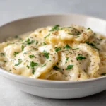 Creamy Crockpot Chicken Alfredo Ravioli is a delightful comfort food that brings together tender chicken and rich, cheesy flavors in a convenient one-pot meal. The creamy Alfredo sauce coats the ravioli while the chicken becomes melt-in-your-mouth tender, making it a perfect choice for family dinners or gatherings with friends. This dish embodies everything we love about comfort food: warmth, richness, and the ability to satisfy even the heartiest of appetites.
