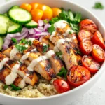 Exploring the nuances of flavor and nutrition, this Chicken Shawarma Bowl is the perfect revitalizing lunch option for anyone looking to combine health and taste into a single dish. Bursting with spices, vibrant vegetables, and a creamy tahini sauce, it's an ideal meal for various dietary needs and preferences. The combination of marinated chicken, nutrient-dense quinoa, and fresh, crunchy vegetables provides a satisfying balance of flavors and textures, making it not only fulfilling but also visually appealing.