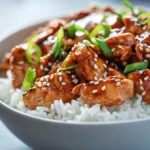 Spicy Maple Chicken with Coconut Rice is a dish that masterfully balances vibrant flavors and texture. The sweetness of pure maple syrup marries beautifully with the fiery kick of sriracha, creating a rich glaze that envelops succulent chicken thighs. Meanwhile, the accompanying coconut rice offers a creamy and fragrant contrast, elevating the dish to a delightful culinary experience. This recipe is not just a treat for your taste buds but also a feast for the eyes, making it perfect for both everyday dinners and festive occasions.