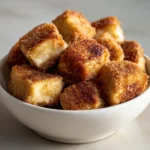 Crispy cinnamon cheesecake bites deliver a delightful experience with every single bite. These sweet treats feature a creamy filling enveloped in a perfectly crispy exterior, making them an ideal choice for special occasions or cozy gatherings at home. This recipe marries the velvety richness of cream cheese with a touch of warm cinnamon and sweet graham cracker crust, creating an indulgent dessert that is just as enjoyable to prepare as it is to savor.