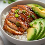 Exploring the vibrant fusion of flavors in Teriyaki Chicken and Avocado Rice Stacks, this article delves into a delightful dish that beautifully combines savory and creamy ingredients for a satisfying meal. The juicy, marinated chicken thighs pair harmoniously with the creamy texture of avocado, while the jasmine rice serves as a perfect canvas that holds all these flavors together. Each bite of the stack offers a contrast of textures, with the crunch of sesame seeds and green onions contrasting against the creaminess of the avocado and the tenderness of the chicken.