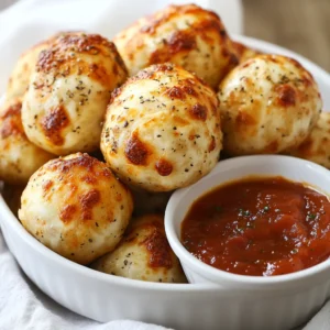 This recipe for Cheesy Pizza Balls Delight encapsulates the joy of pizza in a fun, bite-sized form. These delightful treats are perfect for gatherings, game nights, or simply indulging in a cheesy snack. Imagine the excitement as you pop one of these cheesy balls into your mouth, surrounded by crispy dough and the comforting flavors of pepperoni and bell pepper. Whether you're hosting friends or enjoying a cozy family evening, these pizza balls are sure to be a hit.