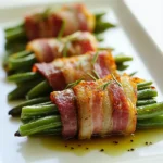 Bacon-wrapped green bean bundles are a delectable dish that blends crispiness and freshness into every bite. This delightful appetizer or side dish highlights the savory flavor of bacon contrasted perfectly against vibrant, tender green beans. With their charming appearance and tantalizing taste, these bundles are sure to steal the spotlight at any gathering, from festive holiday parties to cozy family dinners.