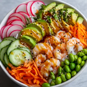 Delve into the vibrant world of sushi bowls, where fresh ingredients come together for a delightful feast for both the eyes and the palate. The Rainbow Sushi Bowl Delight is a celebration of color and flavor, ideal for both casual dinners and special occasions. Each serving is an artistic arrangement of textures and tastes that not only satiates hunger but also brings a burst of freshness to your dining table. This dish is not just visually stunning; it combines healthful ingredients that provide essential nutrients and antioxidants, making it as nutritious as it is delicious.