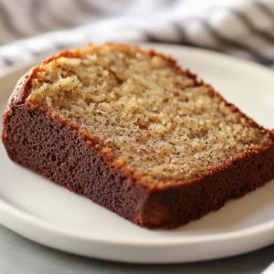 Banana bread is a cherished dessert in American cuisine, enjoyed by many for its rich flavors and comforting texture. The delightful aroma of freshly baked banana bread wafting through the kitchen evokes a sense of home, making it a favorite among families and friends. This simple loaf is not only a delicious treat for breakfast or a snack but also serves as an excellent way to use overripe bananas that might otherwise go to waste.