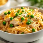 Delve into the comforting essence of American cuisine with this Delicious Ranch Chicken and Noodle Delight. Perfect for busy weeknights, this dish combines tender chicken, a creamy sauce, and hearty egg noodles in a flavorful ranch seasoning mix. The slow-cooked nature of this meal not only satisfies hunger but also enriches family mealtime with its rich flavors and inviting aroma. Imagine walking into your home after a long day to the warm, delectable scent wafting through the air, making this dish an instant comfort food classic that families will love.