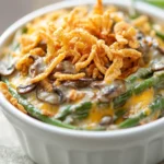 Delve into the heartwarming flavors of a classic dish with this Savory Green Bean Casserole Delight. This recipe beautifully combines fresh green beans with creamy mushroom soup, sharp cheddar cheese, and crispy French fried onions, resulting in a comforting meal that appeals to all ages. It showcases a perfect harmony of flavors and textures that can elevate any dinner table. Ideal for family dinners, holiday gatherings, or casual get-togethers, this casserole is bound to become a beloved staple in your cooking repertoire.
