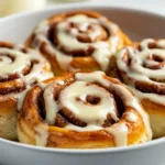 The warm, inviting aroma of homemade cinnamon rolls is a classic that evokes feelings of comfort and indulgence. Fluffy, sweet, and skillfully frosted, these cinnamon rolls are not just a treat but an experience that brings joy to any breakfast or brunch table. There’s something incredibly satisfying about creating such a delightful pastry from scratch. These homemade cinnamon rolls can easily bring the entire family together, and they provide a warm and delicious start to your day or a sweet addition to an afternoon tea.