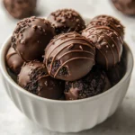 The Decadent No-Bake Oreo Truffles recipe is the perfect combination of creamy, chocolatey, and crunchy flavors, making it a beloved dessert in many American households. These truffles are effortless to prepare, requiring minimal ingredients and no baking, making them a go-to choice for parties, celebrations, and casual gatherings. With a delightful cream cheese filling packed with crushed Oreos and enveloped in smooth chocolate, these treats are sure to leave a lasting impression.