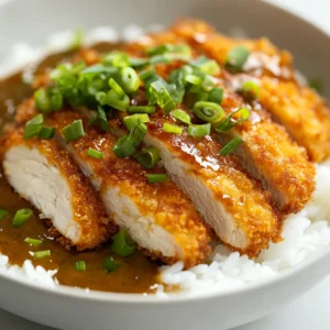 Explore the rich and enticing flavors of Japanese cuisine with this Crispy Japanese Chicken Katsu Curry Delight. This mouthwatering dish brings a harmonious blend of textures and tastes, combining the crispy crunch of breaded chicken with the warming richness of a savory curry sauce. Ideal for a cozy family dinner, this recipe is not only easy to prepare but also delivers restaurant-quality flavors right in your kitchen.